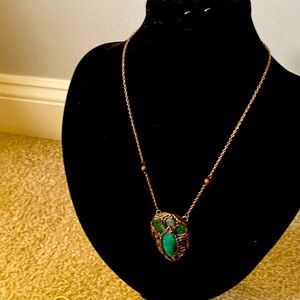 Aventurine semi precious stone pendant with polymer clay/bronze chain.